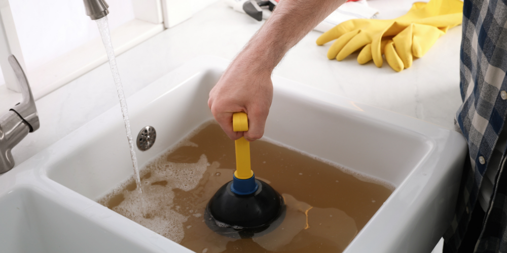 Drain Cleaning to Clear Built-Up Grease and Sludge